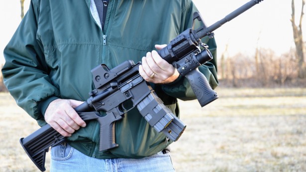 Man-holding-assault-rifle